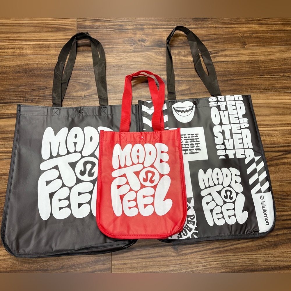 Lot of three Lululemon recycle tote bags, new large black one small red